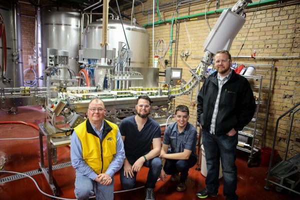 Joe Breker, Phillip Breker, Ryan Bandy and Chef Daniel Miles on a tour at Indeed Brewing Company