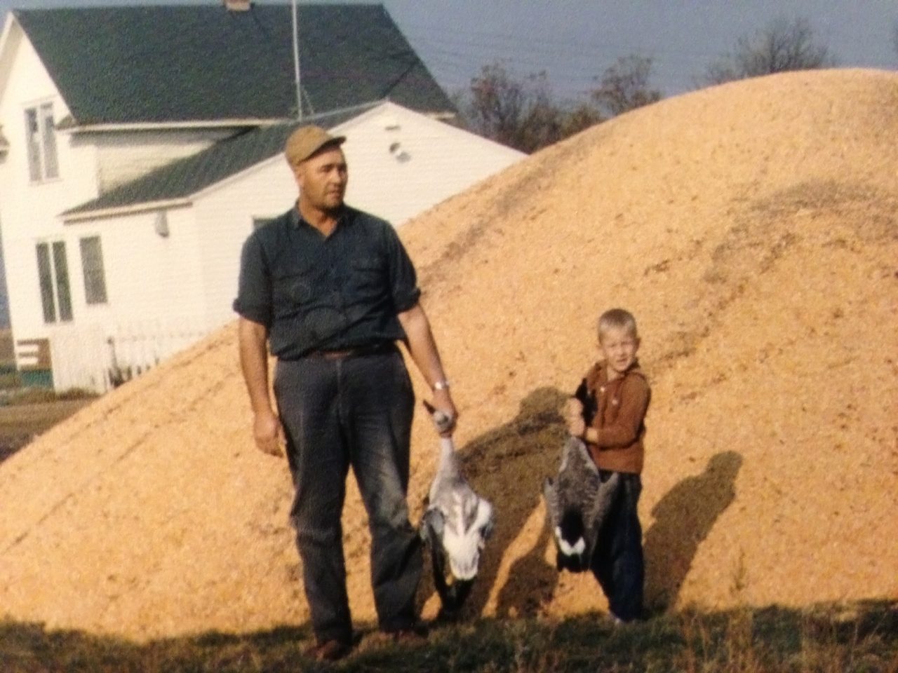 Clarence Breker and young Joe on the farm.